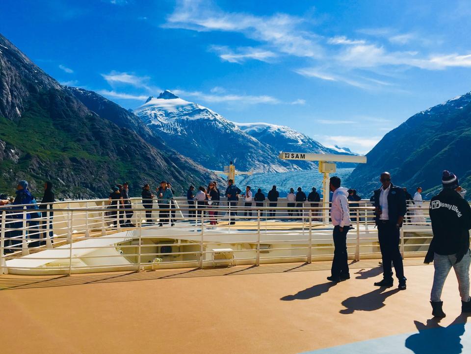 a view of mountains and water off the front of a ship