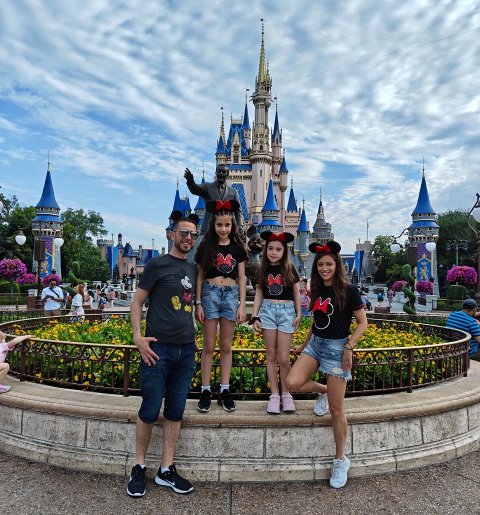 Posing outside magic kingdom