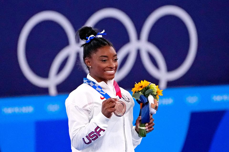 Aug 3, 2021; Tokyo, Japan; Simone Biles (USA) celebrates winning the bronze medal on the balance beam during the Tokyo 2020 Olympic Summer Games at Ariake Gymnastics Centre. Mandatory Credit: Robert Deutsch-USA TODAY Sports