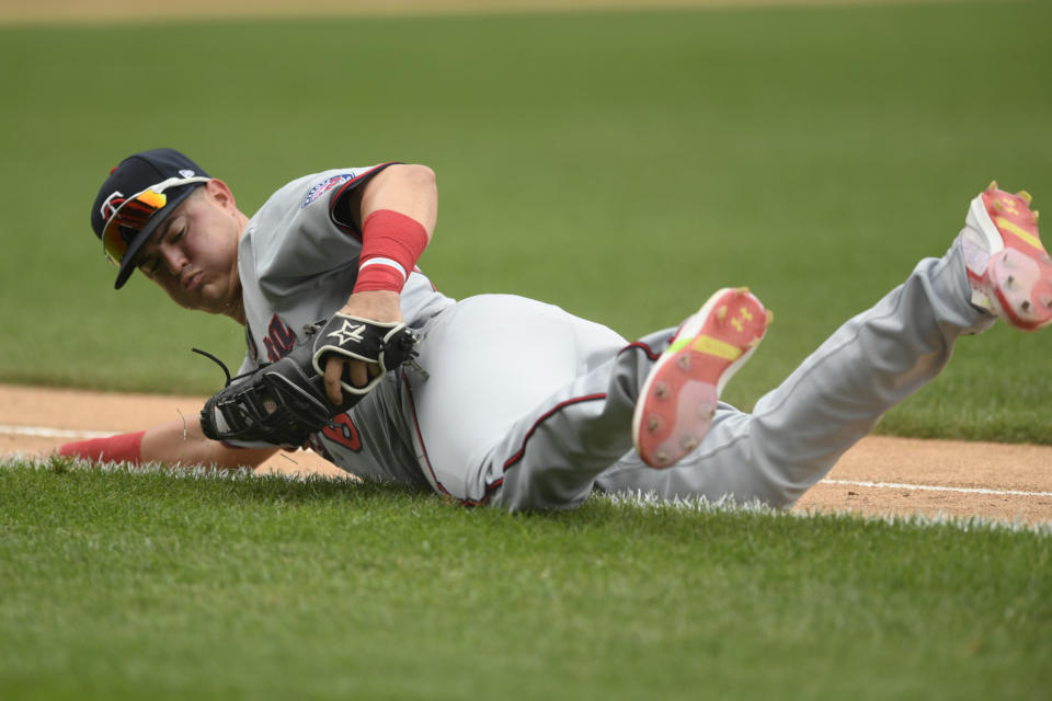 Minnesota Twins first baseman Jose Miranda catches a foul ball hit by Chicago White Sox's Tim Anderson during the third inning of a baseball game, Wednesday, July 6, 2022, in Chicago. (AP Photo/Paul Beaty)