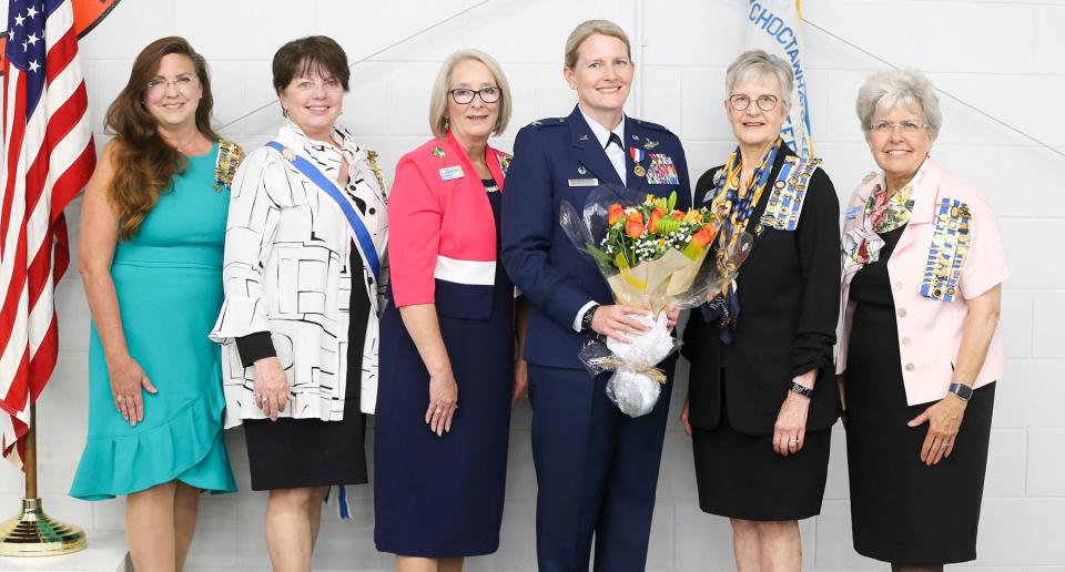 Col. Jocelyn Schermerhorn, commander of the 1st Special Operations Wing at Hurlburt Field, holds flowers after being presented with the Women In American History Medal by the local chapter of the National Society of the Daughters of the American Revolution in a ceremony at the HSU Innovation Institute in Fort Walton Beach. DAR members (left to right) Linda McCooey, LeighAnn Phillips, Lija Eldridge, Caroline Maney and Carolyn Ketchel were among the dozens of people on hand for the presentation.