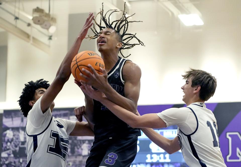 Jun 2, 2023; Goodyear, Ariz., U.S.; PinnacleÕs Braylon Johnson and Connor Corey guard MillenniumÕs Cameron Holmes during the Nike Showdown at Millennium High School. Mandatory Credit: Cheryl Evans-Arizona Republic