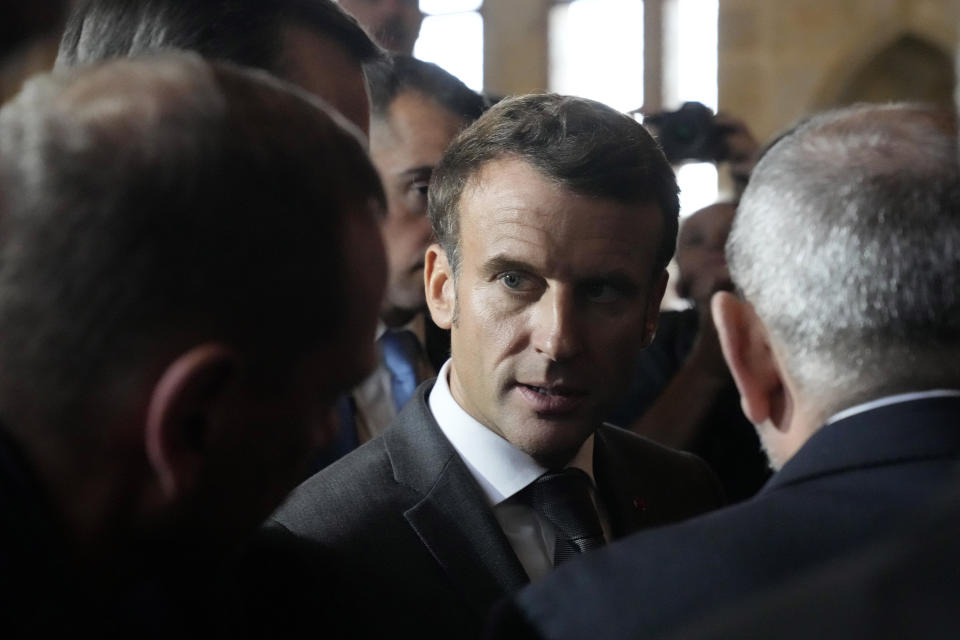 France's President Emmanuel Macron, center, speaks with leaders after a group photo during a meeting of the European Political Community at Prague Castle in Prague, Czech Republic, Thursday, Oct 6, 2022. Leaders from around 44 countries are gathering Thursday to launch a "European Political Community" aimed at boosting security and economic prosperity across the continent, with Russia the one major European power not invited. (AP Photo/Darko Bandic)