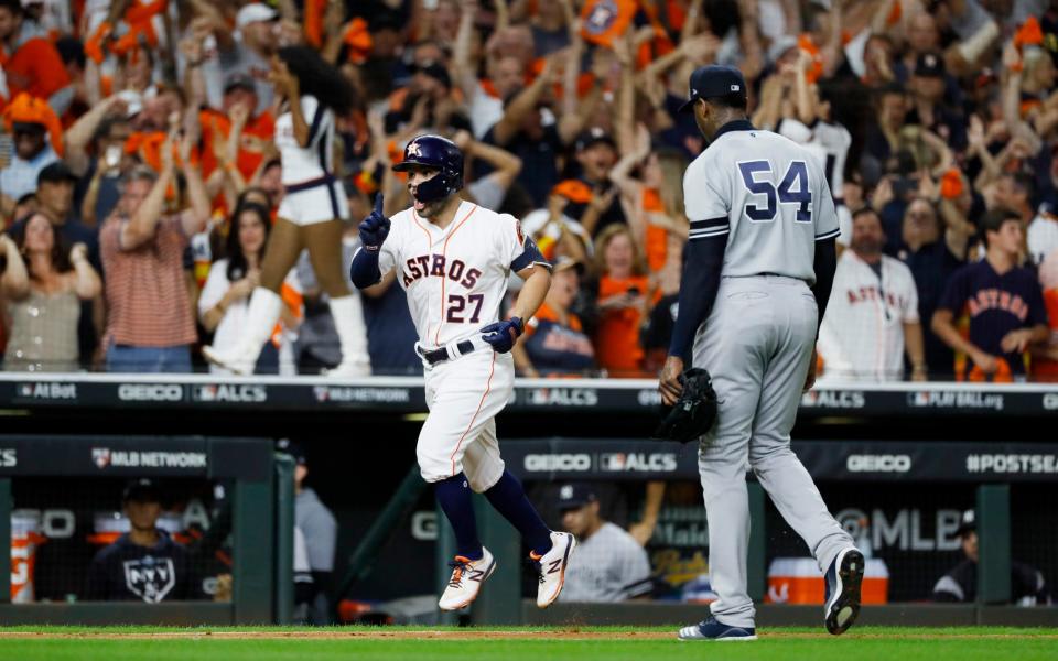Houston Astros' Jose Altuve celebrates after defeating the New York Yankees in Game 6 - AP