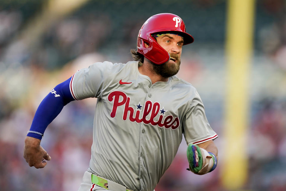 Philadelphia Phillies' Bryce Harper runs to third off a single by Alec Bohm during the first inning of a baseball game against the Los Angeles Angels, Tuesday, April 30, 2024, in Anaheim, Calif. (AP Photo/Ryan Sun)