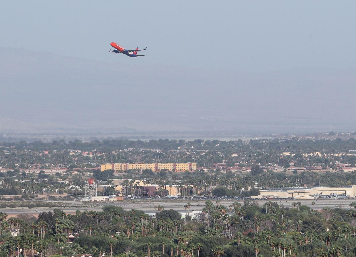 A plane departs Palm Springs International Airport on May 11, 2020.