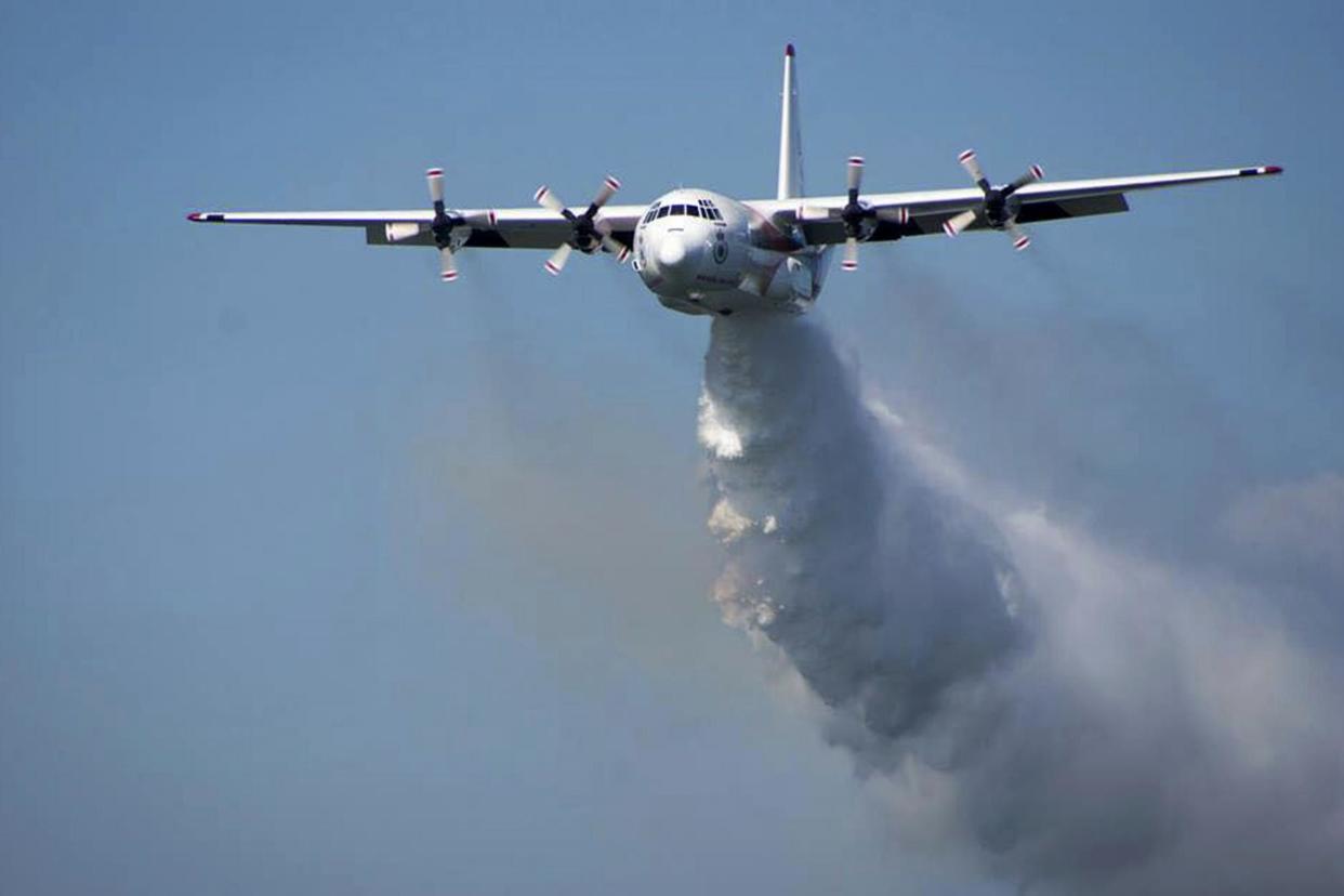 A C-130 Hercules plane called "Thor" drops water during a flight in Australia (file image): AP
