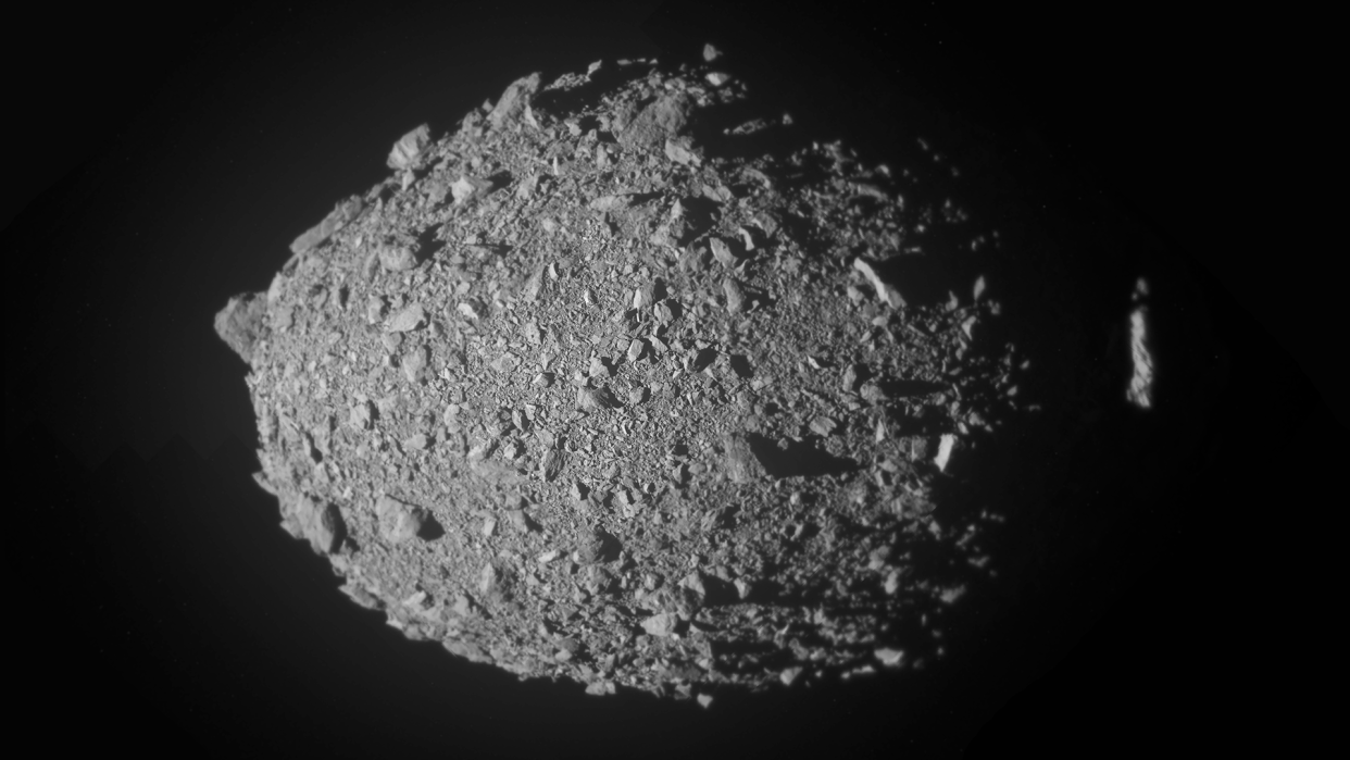  This high-resolution view of the asteroid Dimorphos was created by combining the final 10 full-frame images obtained by the NASA DART probe's Didymos Reconnaissance and Asteroid Camera for Optical navigation (DRACO) and layering the higher-resolution images on top of the lower-resolution ones. Dimorphos is oriented so that its north pole is toward the top of the image. 