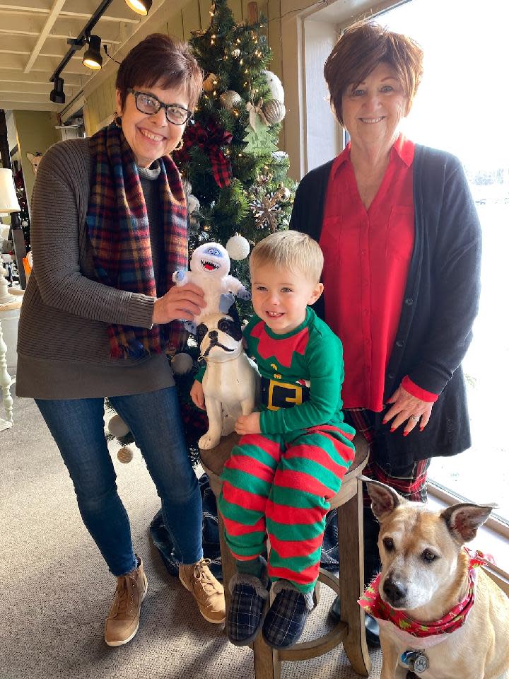 Pictured from left are Laurie Warner, owner of Randolph Home Furnishings; her grandson, Colton Frame, showing off his PJs; Anne Marie Noble, executive director of The Haven of Portage County; and “Echo,” the dog.