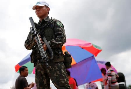 A Brazilian army soldier takes part in a joint military training for humanitarian actions with U.S., Colombians and Peruvians soldiers, in Tabatinga, Brazil, November 8, 2017. REUTERS/Leonardo Benassatto