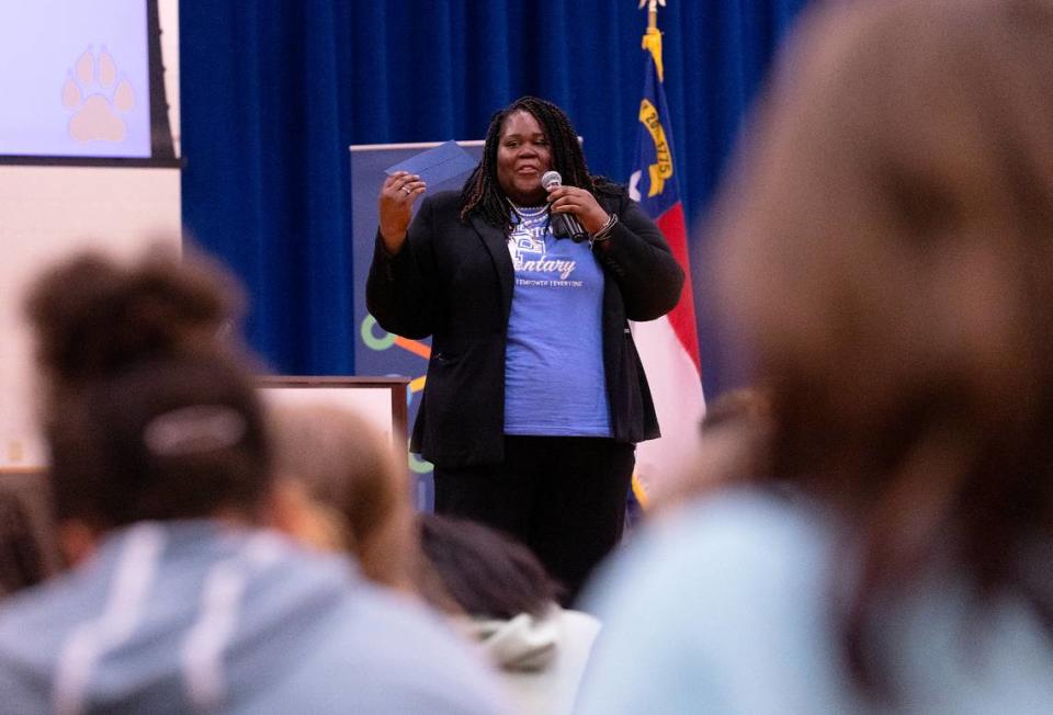 Pearsontown Elementary School Principal Asia Cunningham speaks to students after being presented with a Milken Educator Award on Friday, Nov. 3, 2023, in Durham, N.C.