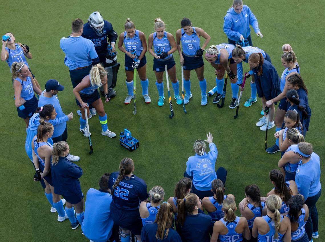 North Carolina coach Erin Matson huddles with her team at the end of regulation tied 1-1 with Northwestern during the NCAA Division I Field Hockey Championship game on Sunday, November 19, 2023 at Karen Shelton Stadium in Chapel Hill, N.C.