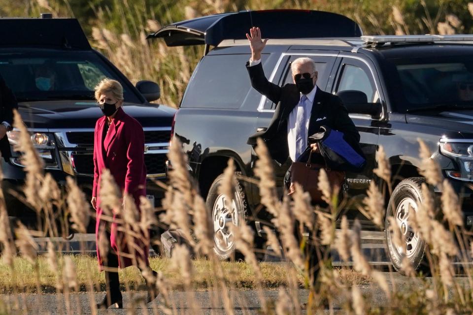 President Joe Biden waves as he and first lady Jill Biden walk to board Marine One at Gordons Pond in Rehoboth Beach on Monday, Nov. 8, 2021, en route to Washington days after announcing the details of his vaccination or testing mandate for large companies.