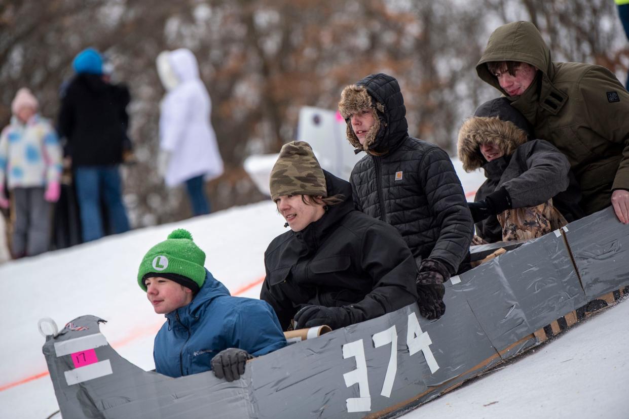 Scenes from the Festivus Cardboard Sled Competition at Leila Arboretum in Battle Creek on Saturday, Feb. 12, 2022.