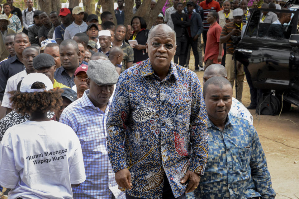 FILE - In this Wednesday. Oct. 28, 2020 file photo, Tanzania's President John Magufuli stands in line to cast his vote in the presidential election at Chamwino in Dodoma, Tanzania. Opposition politicians in March 2021 are raising questions about the health of Tanzania's COVID-19-denying president John Magufuli, as he has not been seen in public for more than a week and there has been no responce to questions from The Associated Press about Magufuli’s health and whereabouts. (AP Photo, File)