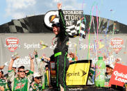 BROOKLYN, MI - JUNE 17: Dale Earnhardt Jr., driver of the #88 Diet Mountain Dew/TheDarkKnightRises/National Guard/ Chevrolet, celebrates in Victory Lane after winning the NASCAR Sprint Cup Series Quicken Loans 400 at Michigan International Speedway on June 17, 2012 in Brooklyn, Michigan. (Photo by John Harrelson/Getty Images for NASCAR)