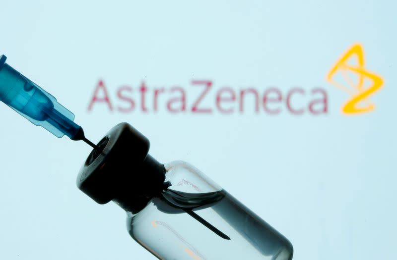 FILE PHOTO: FILE PHOTO: Vial and sryinge are seen in front of displayed AstraZeneca logo