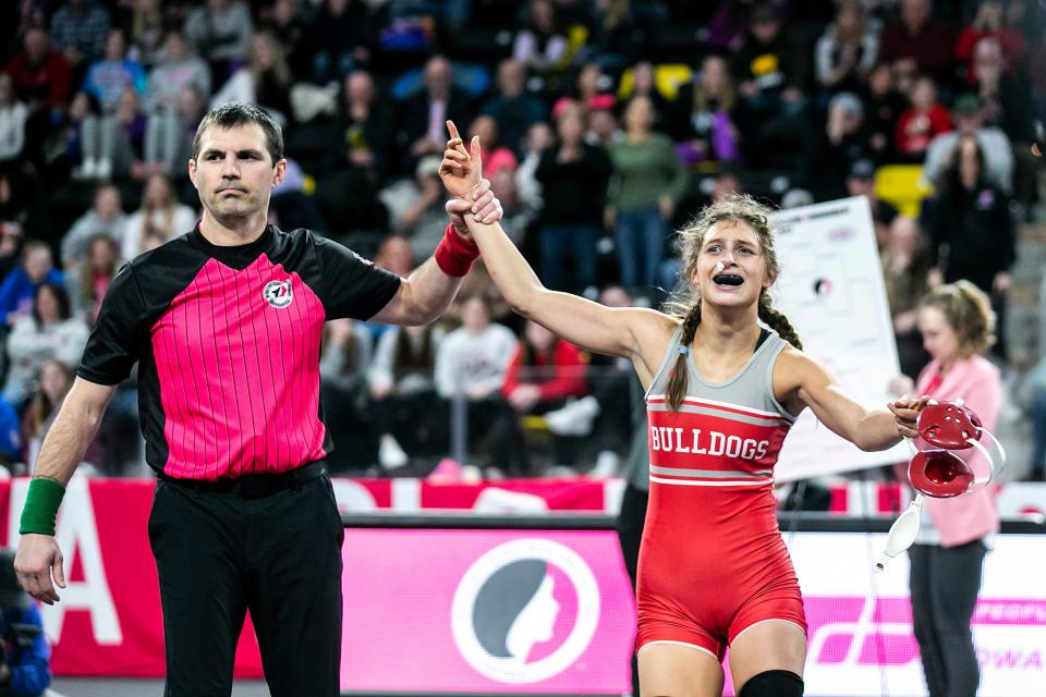 Ottumwa's Jasmine Luedtke celebrates after her match at 110 pounds in the finals during the IGHSAU state girls wrestling tournament, Friday, Feb. 3, 2023, at the Xtream Arena in Coralville, Iowa.
