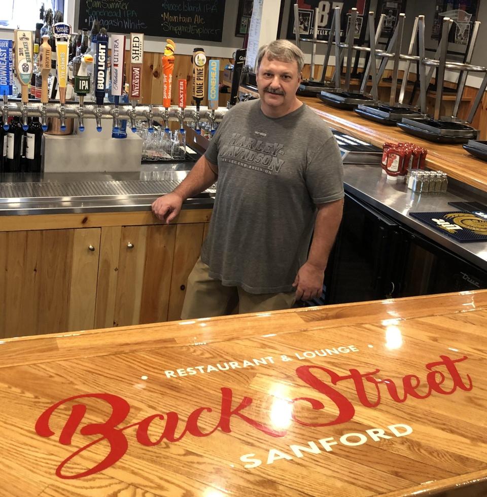 Paul Pelletier is seen here on July 11, 2023, at the bar of Back Street Sanford, the restaurant he owned and operated for five years. Pelletier is retiring and selling the popular spot on School Street in Sanford, Maine.