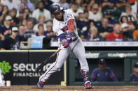 Minnesota Twins' Jorge Polanco hits an RBI single during the second inning of the team's baseball game against the Houston Astros on Thursday, Aug. 5, 2021, in Houston. (AP Photo/Michael Wyke)