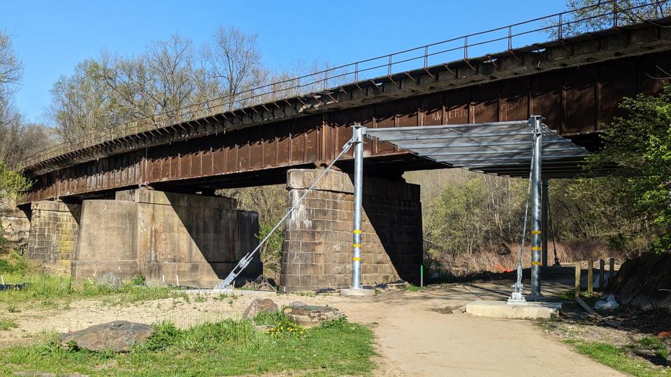 Looking north on April 10th, The protection canopy has been competed under the Norfolk Southern Blackbridge Railroad Bridge on the Heritage Rail Trail. The trail has been officially closed since 2020 due to falling debris.