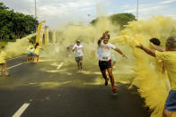 RIO DE JANEIRO, BRAZIL - DECEMBER 16: People run during The Color Run on December 16, 2012 in Rio de Janeiro, Brazil. (Photo by Ronaldo Brandao/NewsFree/LatinContent/Getty Images)