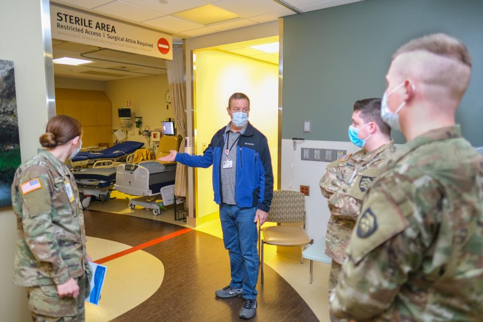 Hospital Facilities Operations Manager Don Wilder gives Oregon Army National Gaurd hospital relief mission members a tour of West Valley Hospital in Dallas, Oregon on Jan. 18.