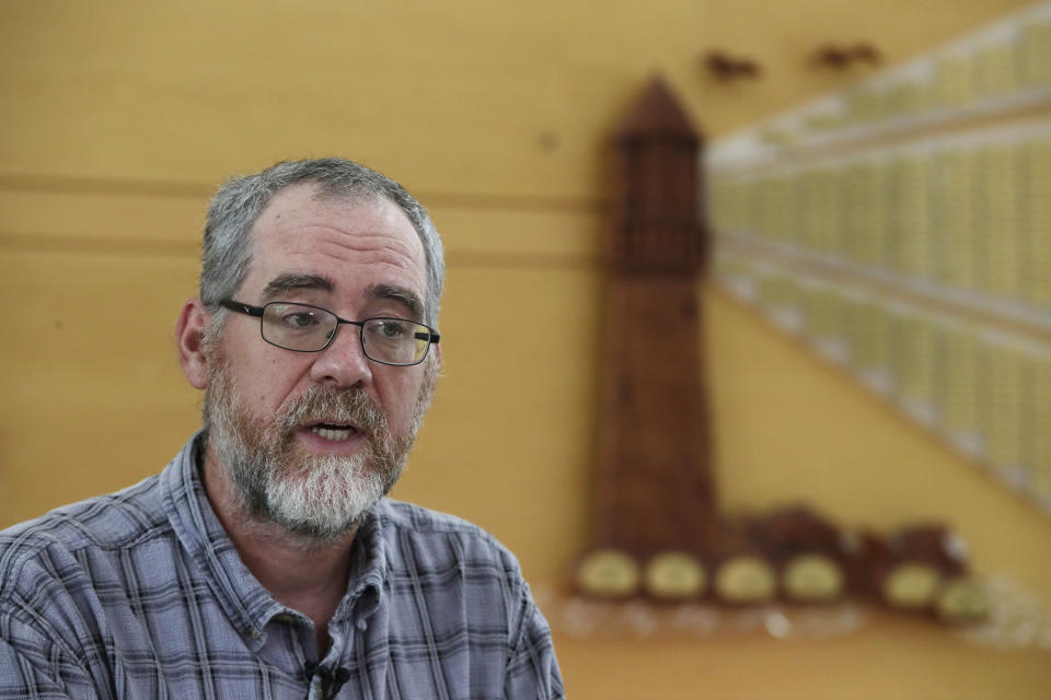 In this Aug. 21, 2019 photo, instructor Chris Powicki speaks during an interview at Cape Cod Community College in West Barnstable, Mass. Powicki's Offshore Wind 101 classes have drawn nuclear and marina workers, engineers, young people and others hoping for good-paying wind jobs as an alternative to tourism jobs. But as Trump has made clear how much he hates wind turbines, all the offshore wind projects, including the nation's first utility-scale offshore wind project, an 84 turbine, $2.8 billion wind farm slated to rise 15 miles off Martha's Vineyard, have stalled. (AP Photo/Elise Amendola)