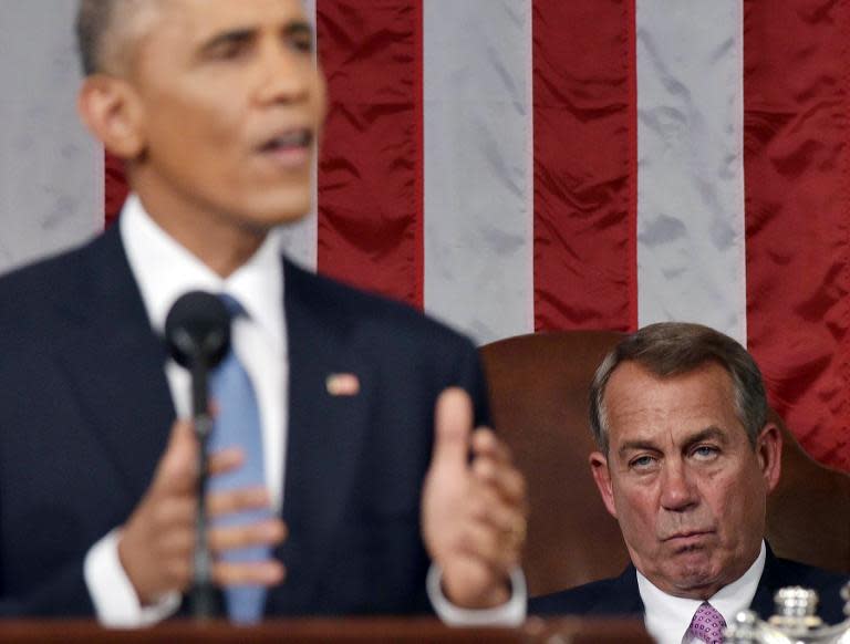 US Speaker of the House John Boehner (R) listens to US President Barack Obama deliver the State of the Union address before a joint session of Congress on January 20, 2015 at the US Capitol in Washington, DC