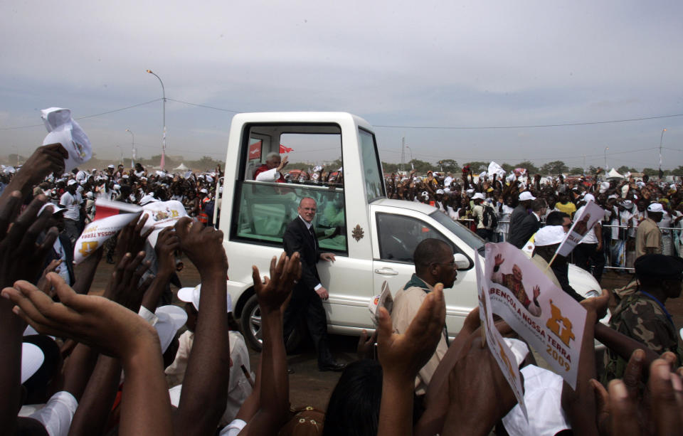 FILE - Pope Benedict XVI arrives for a Holy Mass at Cimangola grounds in Luanda, Angola, on March 22, 2009. Pope Emeritus Benedict XVI, the German theologian who will be remembered as the first pope in 600 years to resign, has died, the Vatican announced Saturday. He was 95. (AP Photo/Themba Hadebe, File)