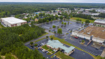 This aerial drone photo shows the Call Federal Credit Union building, front, Tuesday June 16, 2020, in Midlothian, Va. Police were able to obtain geofence search warrants, a tool being increasingly used by law enforcement. The warrant sought location histories kept by Google of cellphones and other devices used within 150 meters (500 feet) of the bank. (AP Photo/Steve Helber)