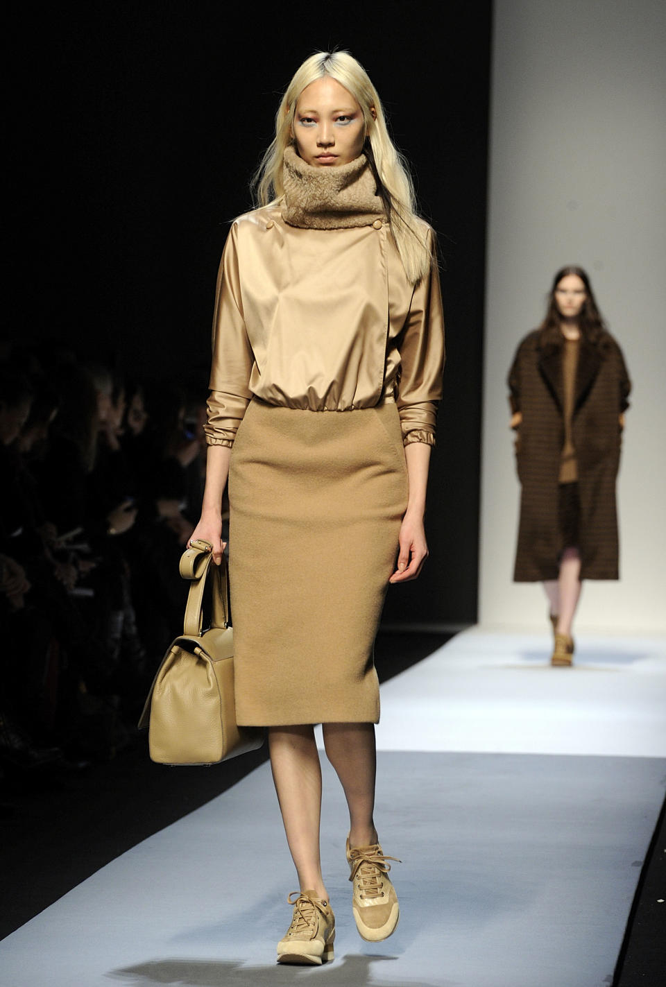 A model wears a creation for Max Mara women's Fall-Winter 2013-14 collection, part of the Milan Fashion Week, unveiled in Milan, Italy, Thursday, Feb. 21, 2013. (AP Photo/Giuseppe Aresu)