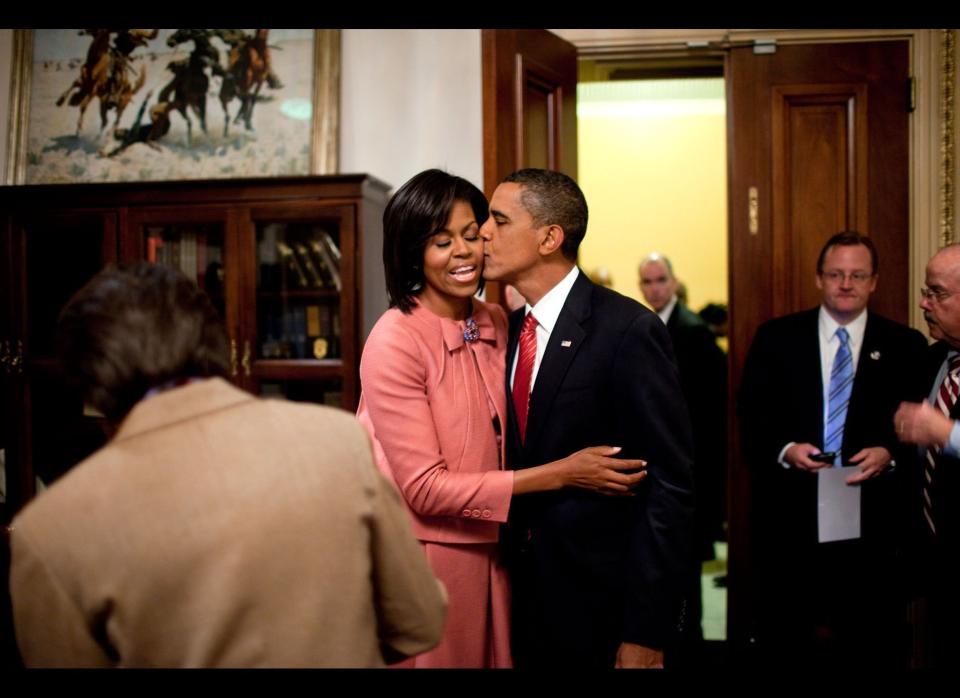 President Barack Obama kisses First Lady Michelle Obama after speaking about health care at a joint session of Congress, Sept. 9, 2009.     