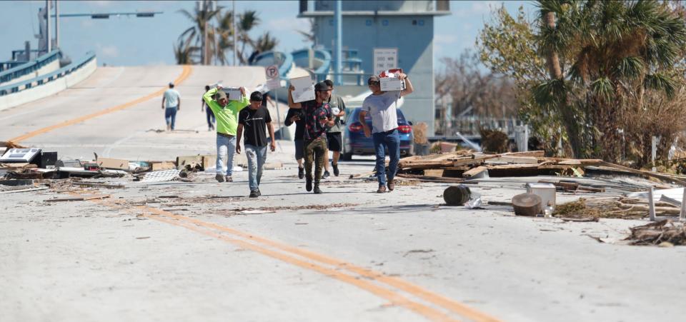 Debris from Hurricane Ian is scattered throughout what remains of Pine Island Road in Matlacha on Sunday, Oct. 2, 2022.