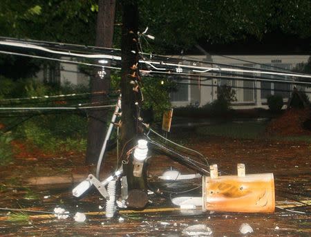 The remains of a snapped telephone pole and its transformer block a road in the rain and wind from Hurricane Hermine in Tallahassee, Florida, U.S. September 2, 2016. REUTERS/Phil Sears