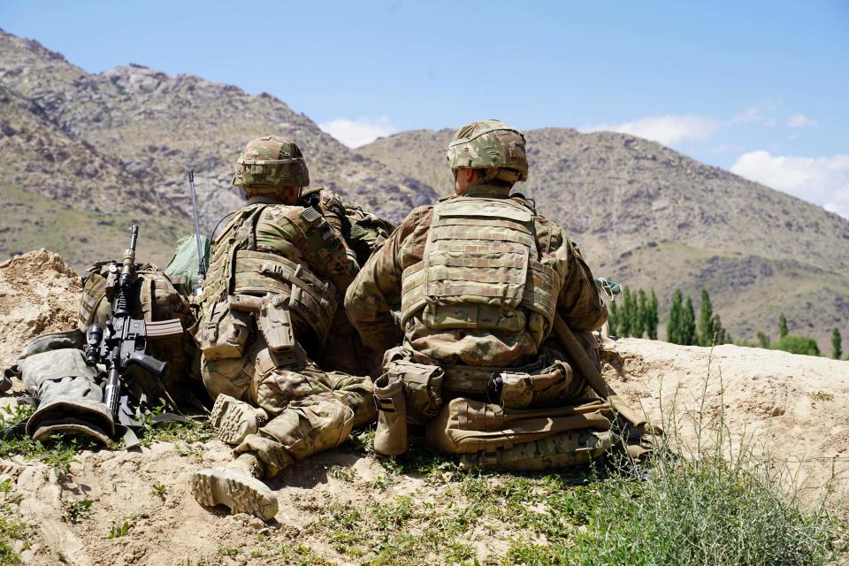 In this photo taken on June 6, 2019, US soldiers look out over hillsides in the Nerkh district of Wardak province in Afghanistan in June 2019.. (Thomas Watkins/AFP via Getty Images)