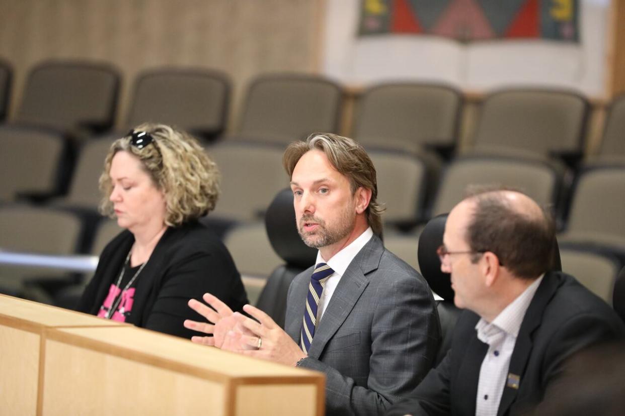 Economic Development Regina CEO Chris Lane, along with staff members from the organization, speak at a meeting of Regina city council on May 22, 2024. (Alexander Quon/CBC - image credit)