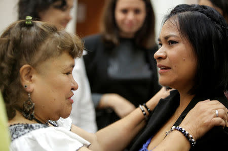 Claudia Hernandez (R), a victim of the 2006 land conflict in San Salvador Atenco in Mexico, is comforted after her hearing was convened by the judges of the Inter-American Court of Human Rights in San Jose, Costa Rica November 16, 2017. REUTERS/Juan Carlos Ulate