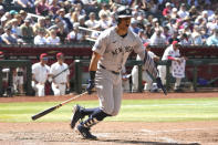 New York Yankees' Juan Soto reacts after hitting a line drive against the Arizona Diamondbacks in the sixth inning during a baseball game, Wednesday, April 3, 2024, in Phoenix. (AP Photo/Rick Scuteri)