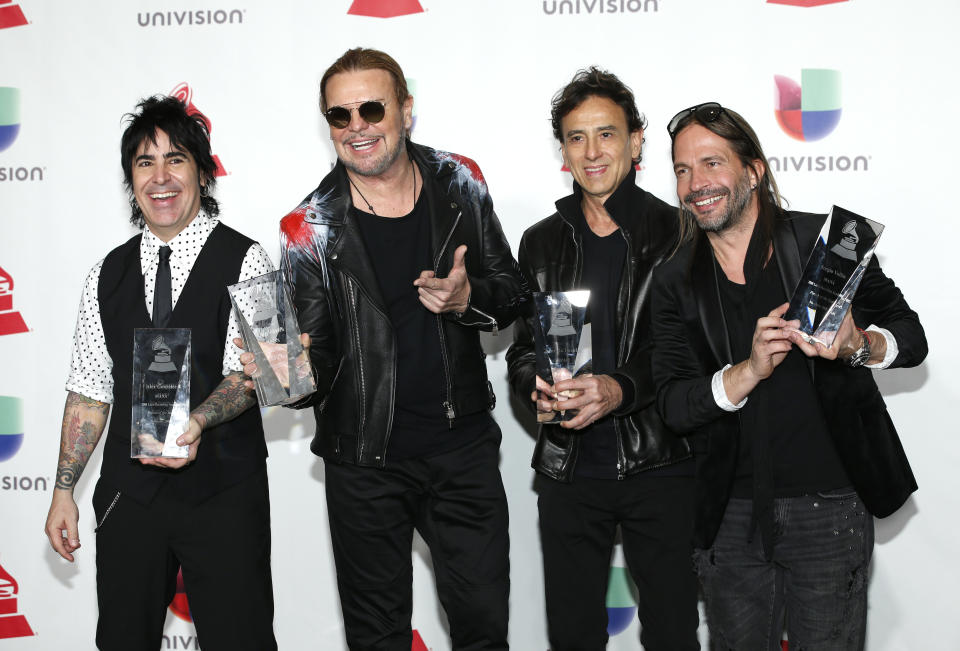 FILE - Alex Gonzalez, from left, Fher Olvera, Juan Calleros and Sergio Vallin, of Mana, pose in the press room with the award for Person of the Year at the Latin Grammy Awards in Las Vegas on Nov. 15, 2018. The band will play OVO Arena Wembley in London next year. (Photo by Eric Jamison/Invision/AP, File)