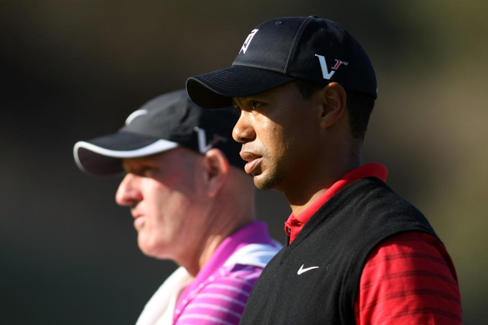 THOUSAND OAKS, CA - DECEMBER 04: Tiger Woods stands with his caddie on the Joe Lacava during the final round of the Chevron World Challenge at Sherwood Country Club on December 4, 2011 in Thousand Oaks, California. (Photo by Robert Meggers/Getty Images)