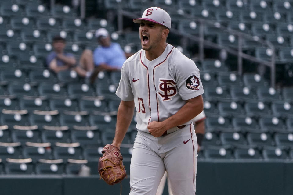 Florida State pitcher Jonah Scolaro celebrates the team's win against Miami in an NCAA college baseball game at the Atlantic Coast Conference tournament Friday, May 28, 2021, in Charlotte, N.C. (AP Photo/Chris Carlson)