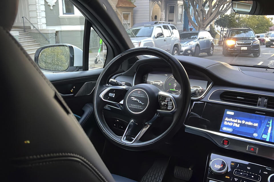 FILE - A Waymo driverless taxi drives on the street during a test ride in San Francisco, on Feb. 15, 2023. Self-driving car pioneer Waymo announced Thursday, May 4, that its robotaxis will start to pick up more volunteers for testing the autonomous vehicles traversing the more challenging conditions in San Francisco. (AP Photo/Terry Chea, File)