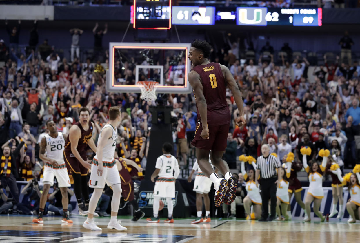 Loyola-Chicago guard Donte Ingram (0) celebrates sinking a 3-point basket in the closing seconds of the second half of a first-round game against Miami at the NCAA college basketball tournament in Dallas, Thursday, March 15, 2018. Loyola-Chicago won 64-62. (AP Photo/Tony Gutierrez)