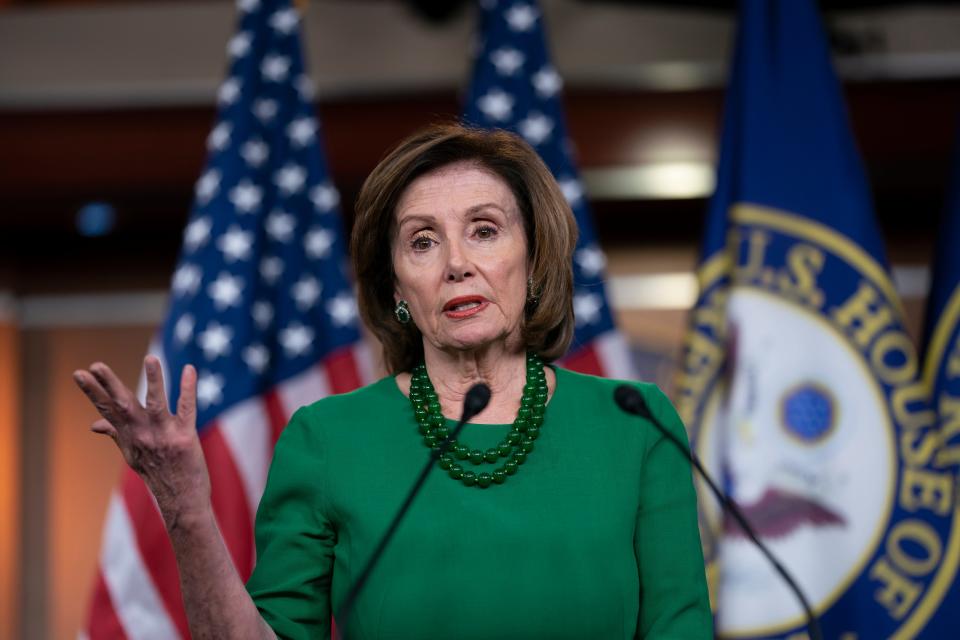 House Speaker Nancy Pelosi, D-Calif., updates reporters as lawmakers worked on a coronavirus aid package in Washington on Thursday.