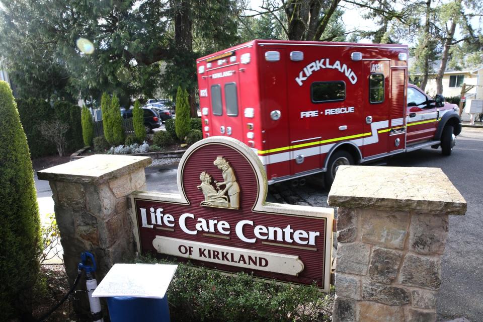 <span class="caption">The Life Care Center in Kirkland, Washington, where 13 people have died from COVID-19 as of March 8. Others inside have tested positive for the coronavirus.</span> <span class="attribution"><a class="link " href="https://www.gettyimages.com/detail/news-photo/an-ambulance-leaves-the-life-care-center-on-march-7-2020-in-news-photo/1205708107?adppopup=true" rel="nofollow noopener" target="_blank" data-ylk="slk:Getty Images / Karen Ducey;elm:context_link;itc:0;sec:content-canvas">Getty Images / Karen Ducey</a></span>