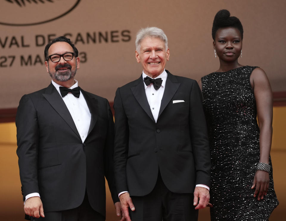 Director James Mangold, left, Harrison Ford, and Shaunette Renee Wilson pose for photographers upon arrival at the premiere of the film 'Indiana Jones and the Dial of Destiny' at the 76th international film festival, Cannes, southern France, Thursday, May 18, 2023. (Photo by Scott Garfitt/Invision/AP)
