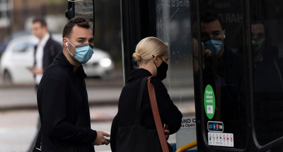 Sydneysiders are required to wear face masks on public transport. Source: Getty