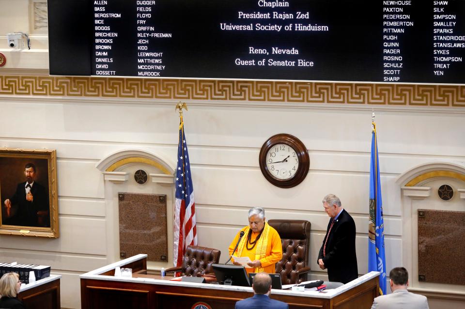 As Sen. Gary Stanislawski, R-Tulsa, looks on as Hindu statesman Rajan Zed delivers the invocation at the start of a session of the Oklahoma Senate in 2018 at the state Capitol.