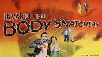 the poster for the classic horror movie invasion of the body snatchers, featuring a couple running away from an unseen threat